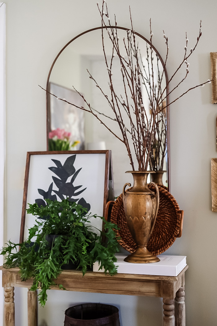 entryway table styled with thrift store finds for an inexpensive update.