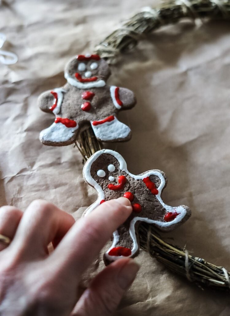 making a wreath out of gingerbread salt dough men