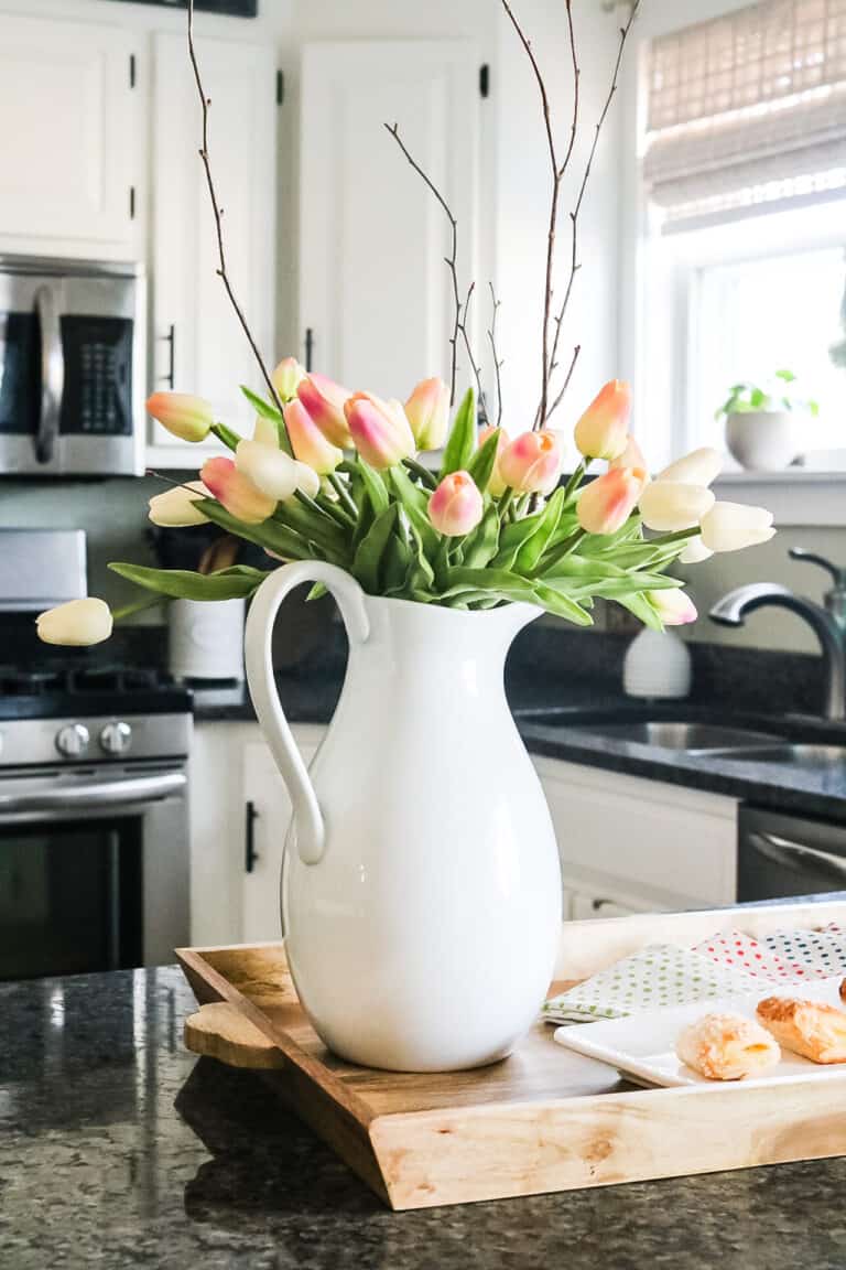 spring kitchen with pitcher of tulips on counter