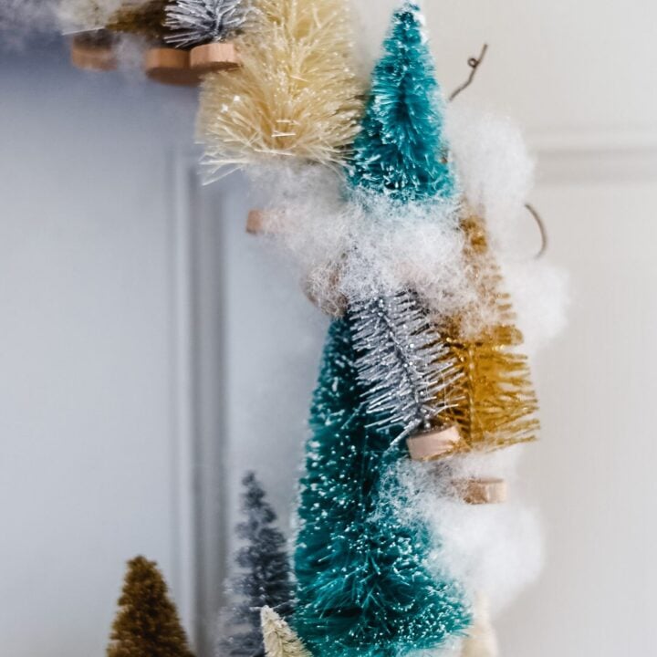 half of a bottle brush tree wreath with snow