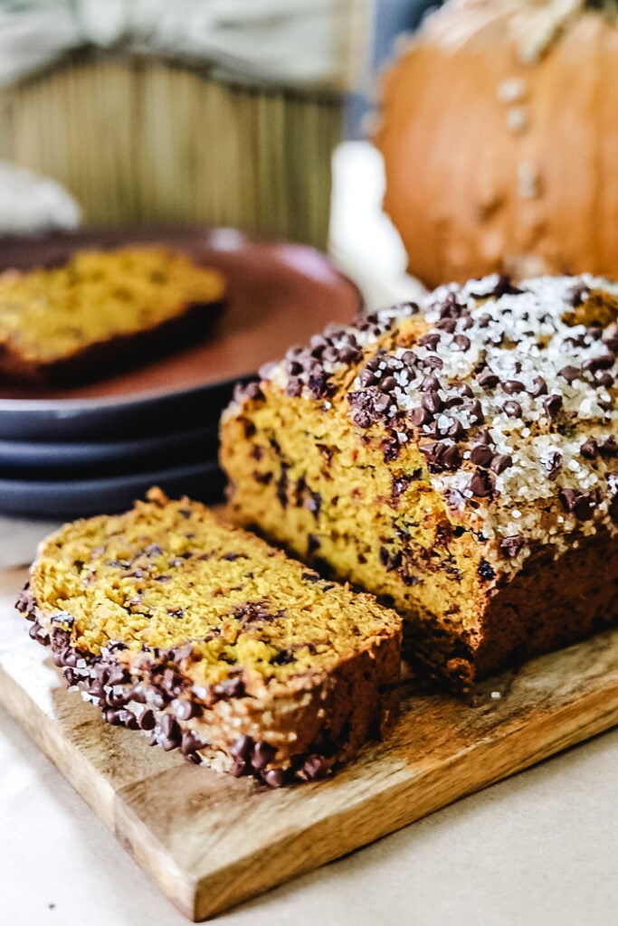 Chocolate Chip Pumpkin Bread on a cutting board sliced