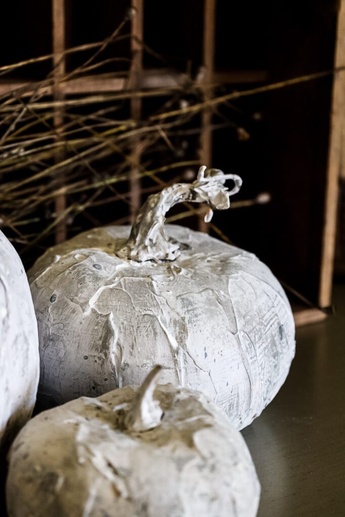 fake cement pumpkin display