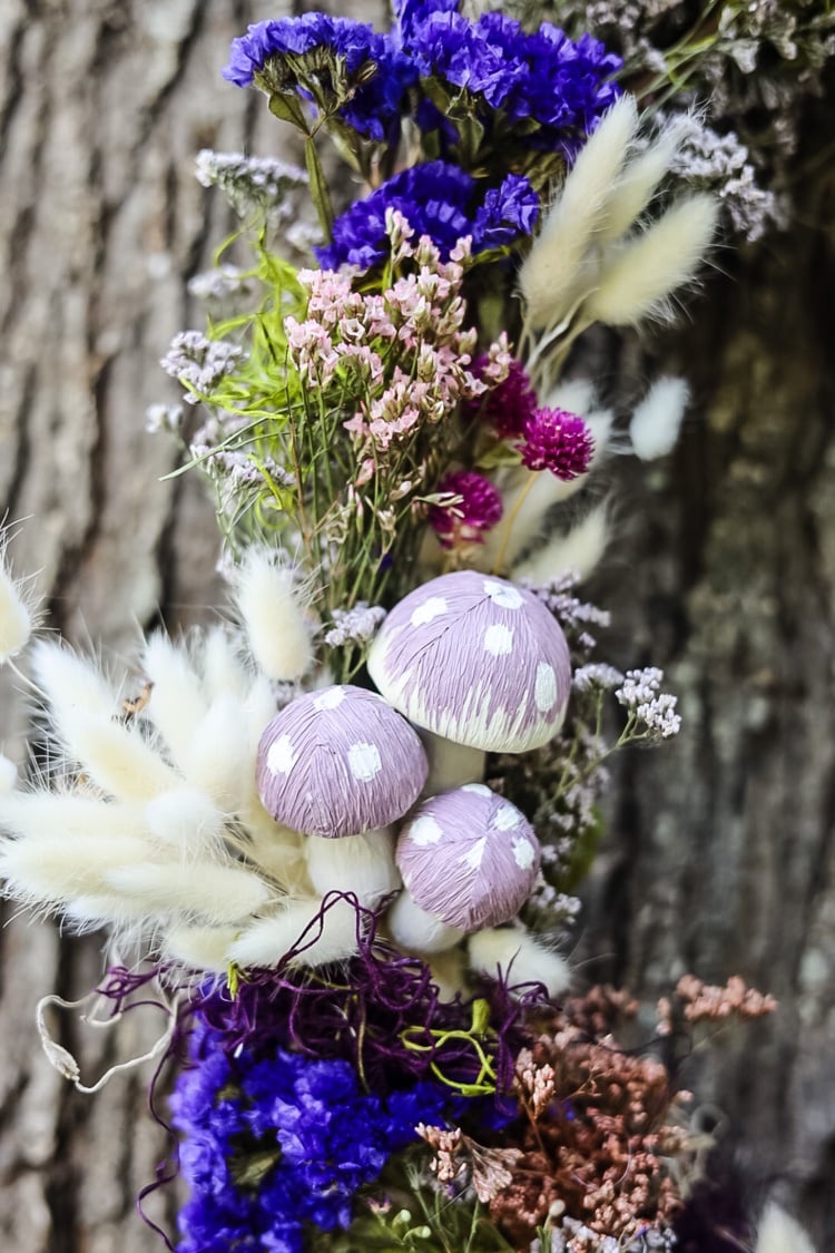 close up of a fairy wreath with mushrooms and dried flowers