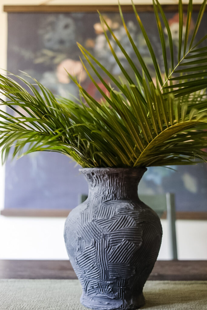 vase filled with tall palms