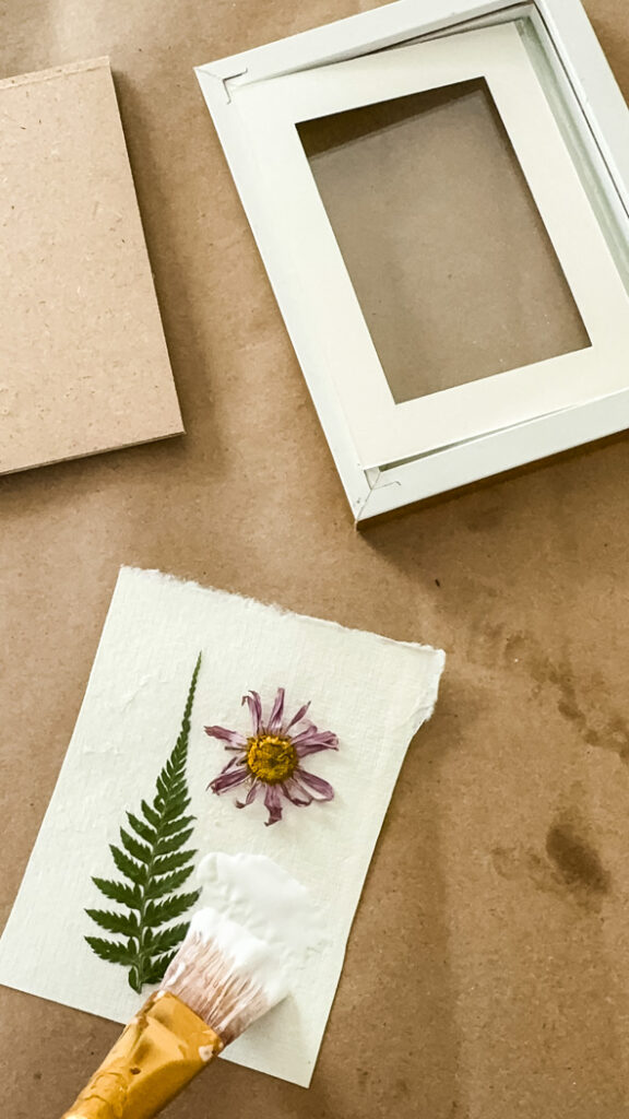 decoupage flower frames being made