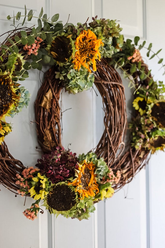 grapevine pumpkin shaped wreath with fresh flowers