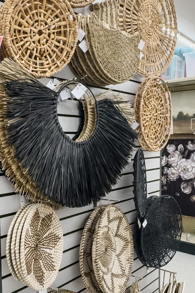 an endcap in Hobby Lobby filled with woven wall art.