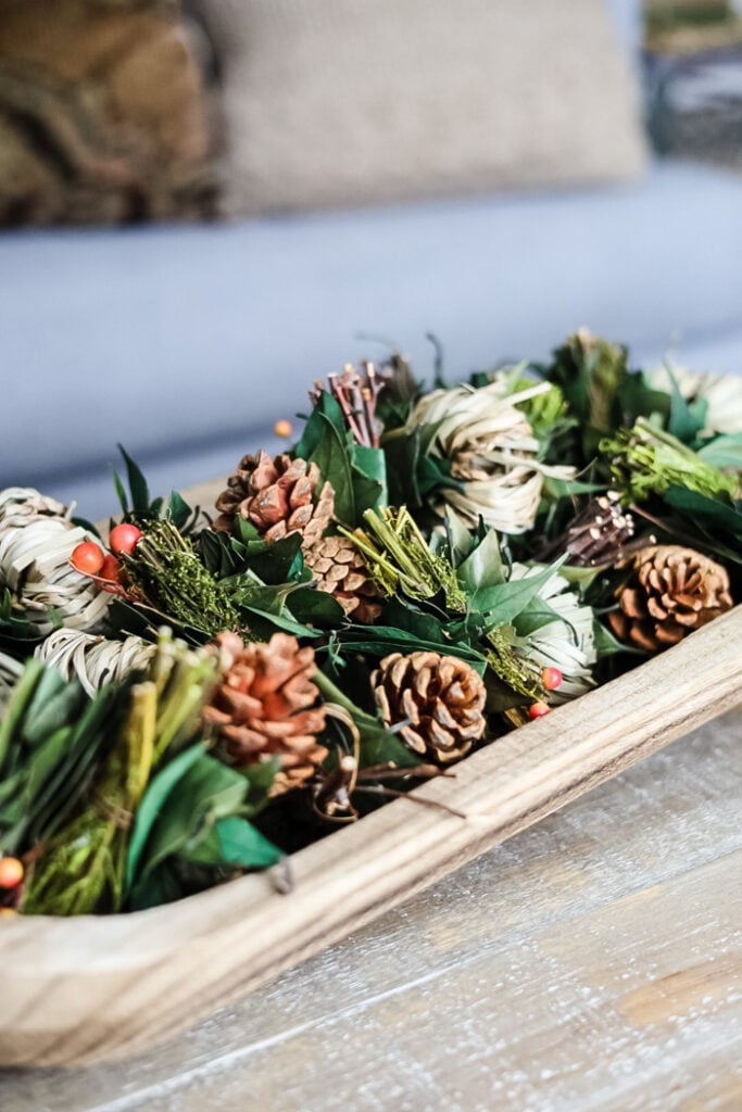 dough bowl filled with seasonal Fall natural decor
