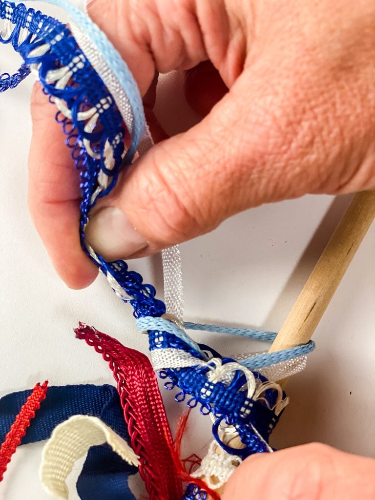 tying ribbon to a dowel