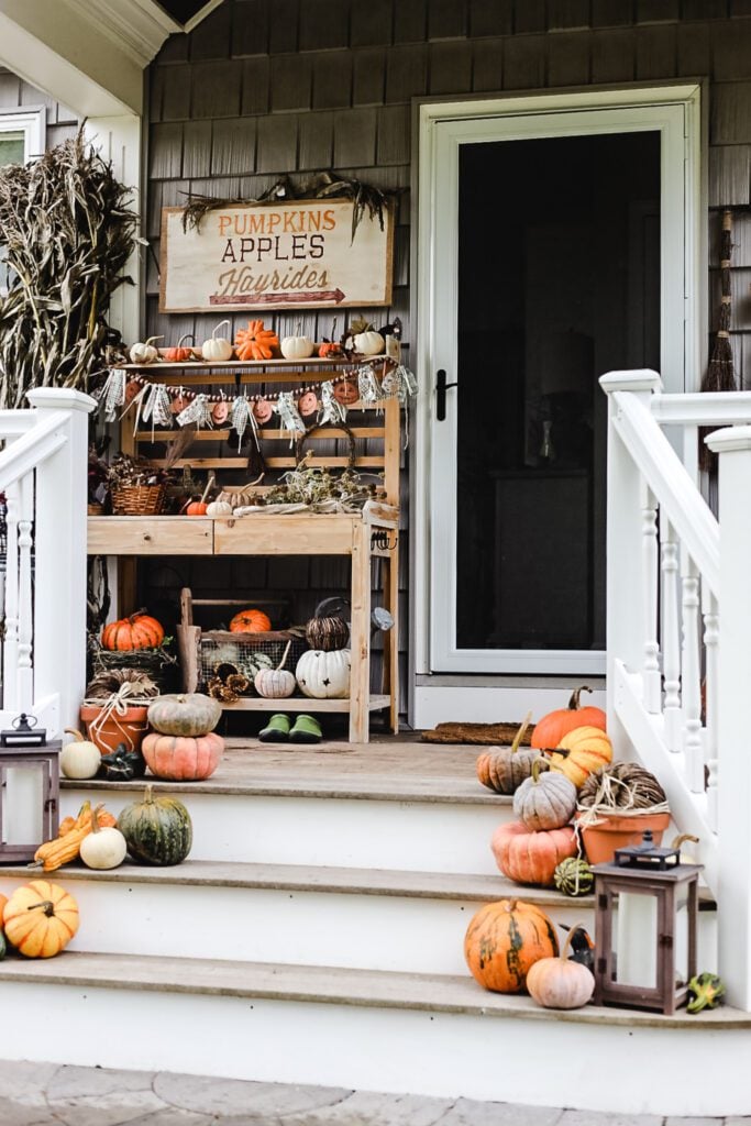 fall front porch decorated with pumpkins